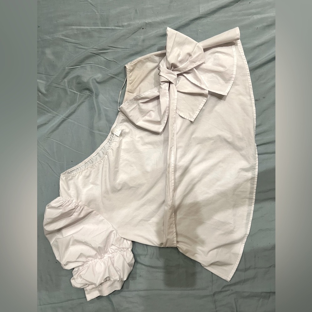 White shirt, one sleeve wraparound bow
